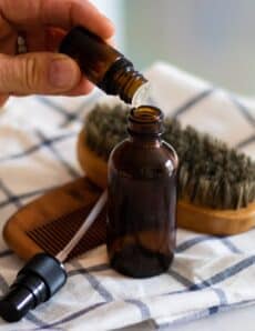 Adding essential oils to aftershave.