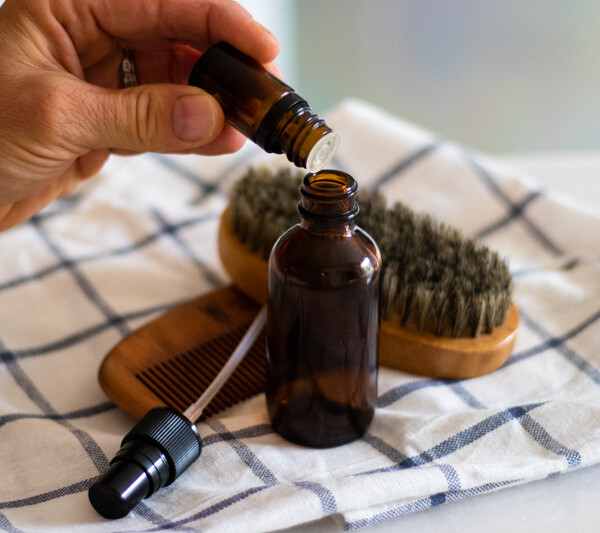 Adding essential oils to aftershave.