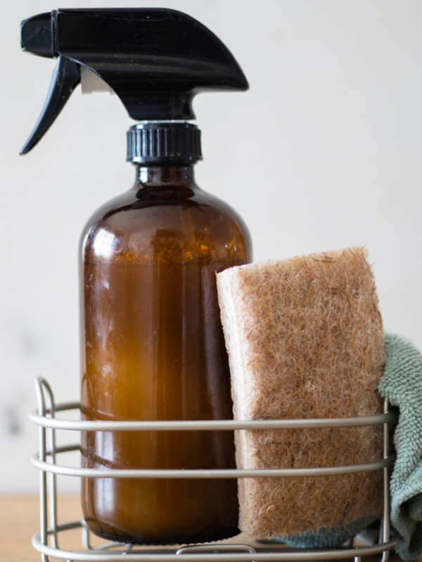 Homemade granite cleaner with tan sponge.