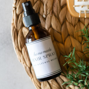 Homemade hair spray in amber glass bottle.