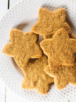 white plate of coconut sugar star shaped cookies