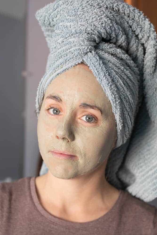 women with clay mask on her face