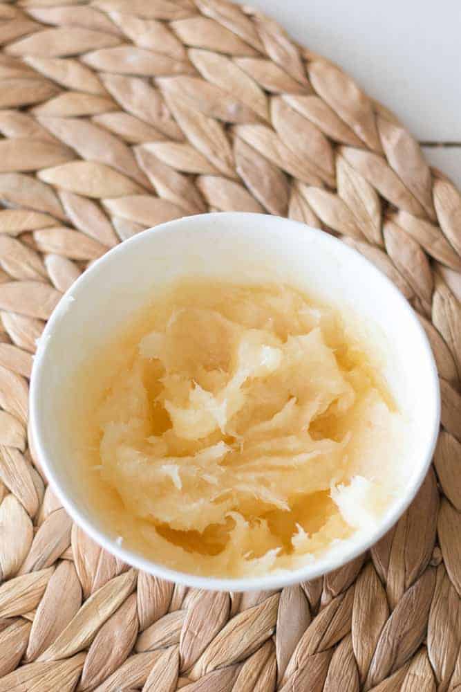 Coconut honey hair mask in white bowl.