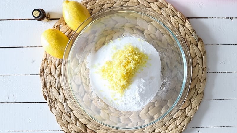 bowl of ingredients for garbage disposal tablets on a white wooden table 