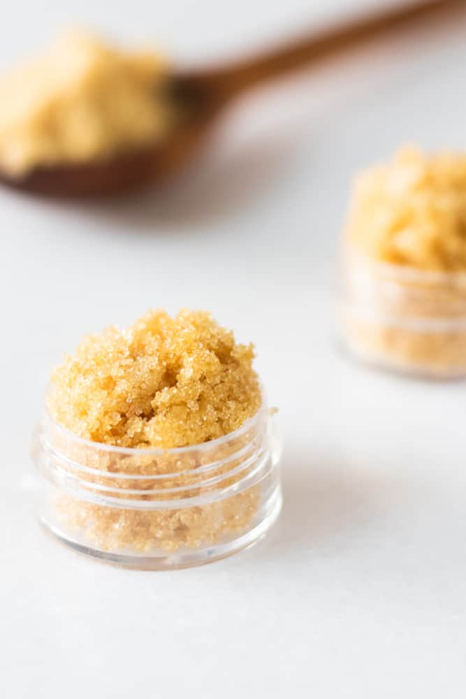 Brown sugar lip scrub in small glass container.