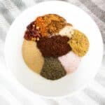 Homemade taco seasoning spices in a white bowl.