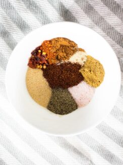 Homemade taco seasoning spices in a white bowl.