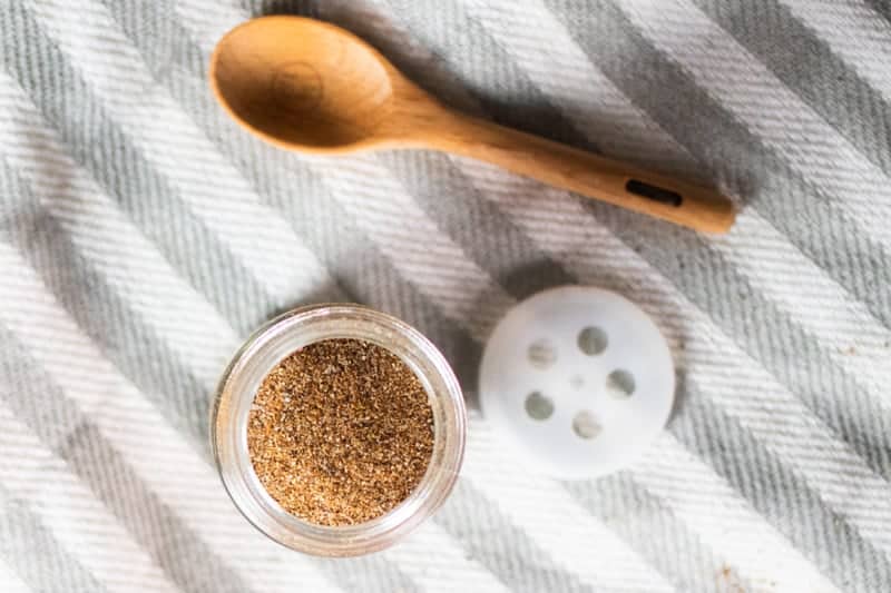 open spice jar filled with gluten free taco seasoning