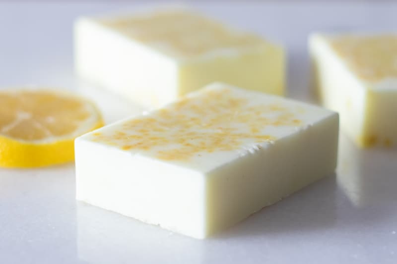homemade lemon soap bars on white marble