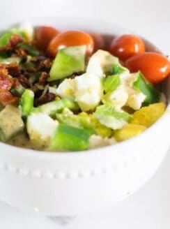 healthy cobb salad in white bowl