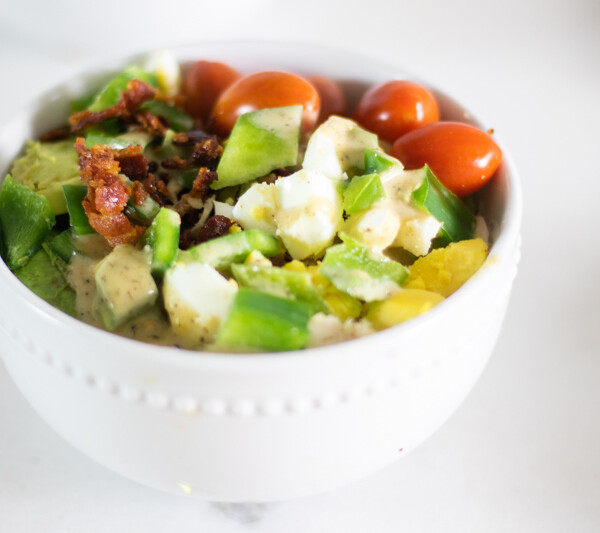 healthy cobb salad in white bowl