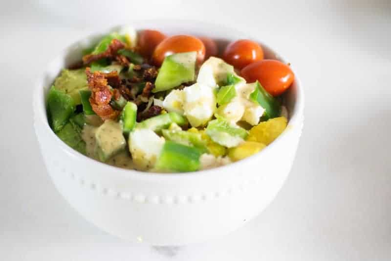 healthy cobb salad in white bowl