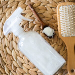 diy hair protective spray with tan brush and wooden measuring spoon