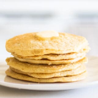 stack of sourdough pancakes on white plate