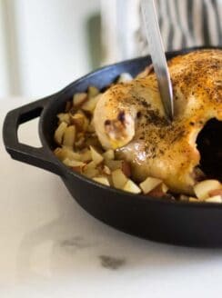 carving roasted whole chicken in cast iron skillet