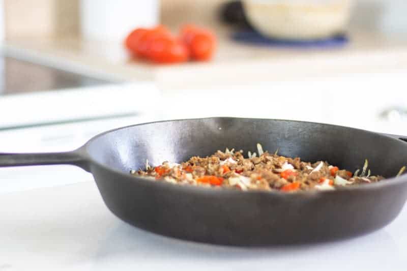 cast iron skillet pizza on white table