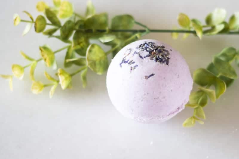 purple bath bomb with dried lavender buds