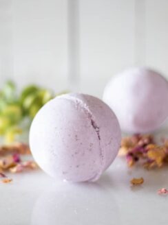 Purple bath bombs on white marble.