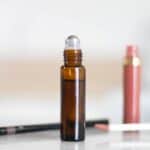 eyebrow roller bottle serum on white marble