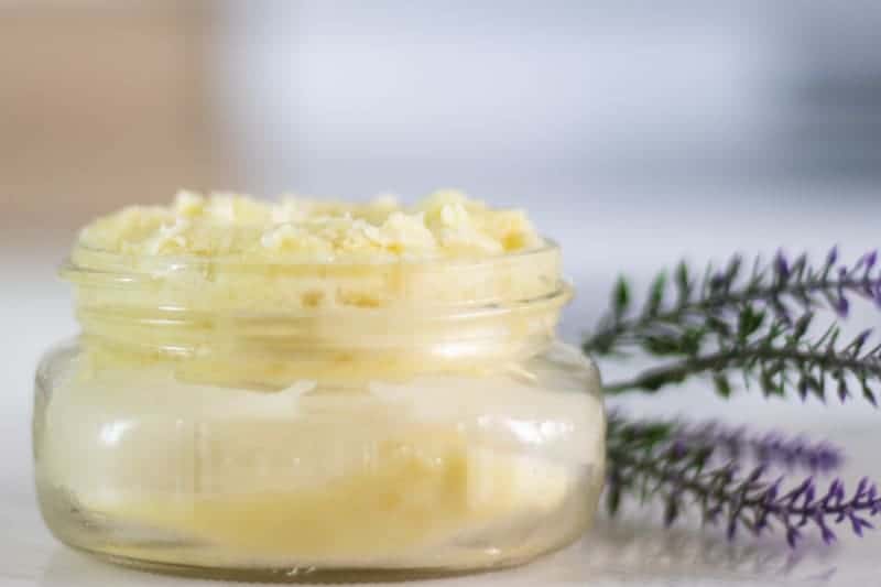 homemade magnesium lotion in mason jar with lavender sprigs