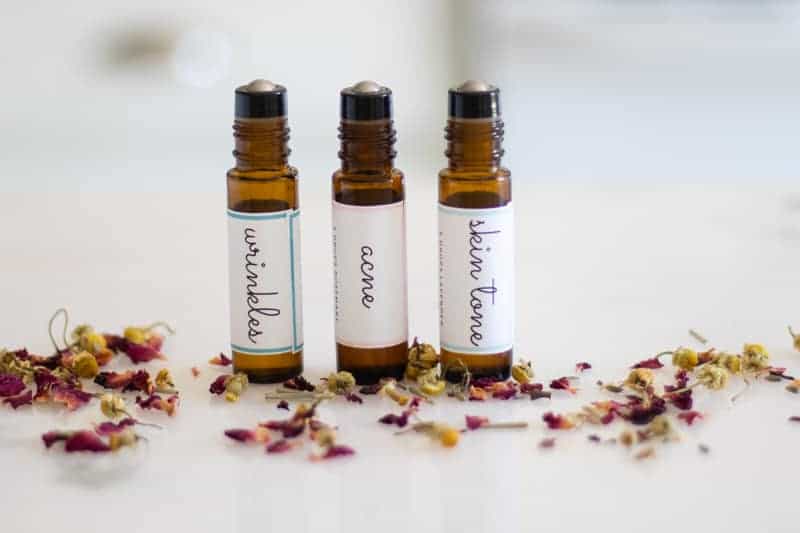 three essential oil roller bottles with labels