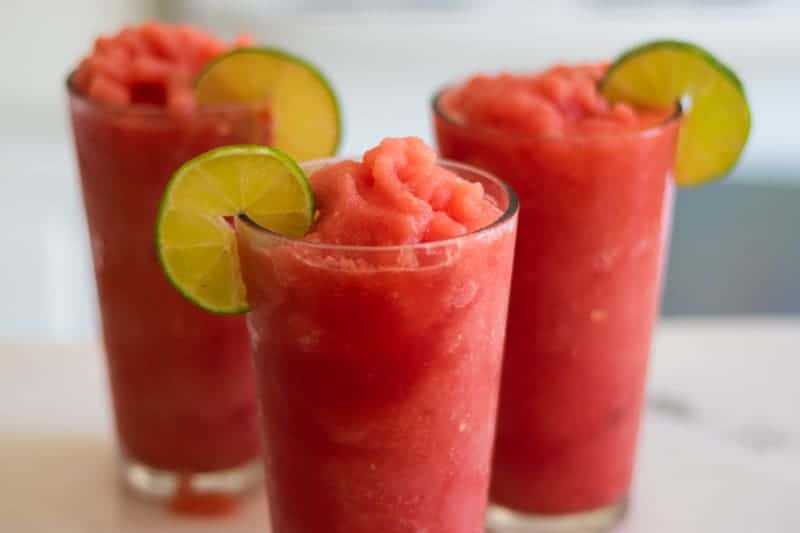 three glasses of homemade watermelon and fresh lime slushies