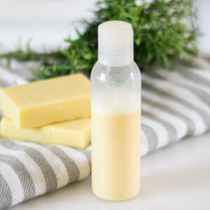 shampoo bottle with homemade conditioner bars in background