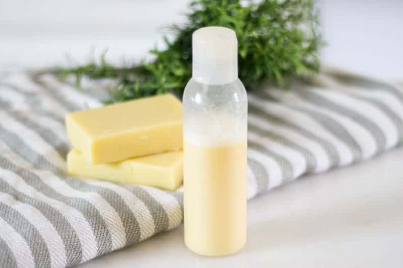 shampoo bottle with homemade conditioner bars in background