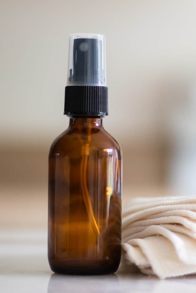 DIY hair toner in a glass spray bottle.