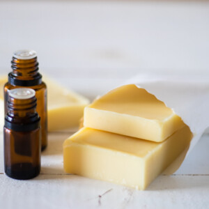 Homemade conditioner bars in a white storage pouch.