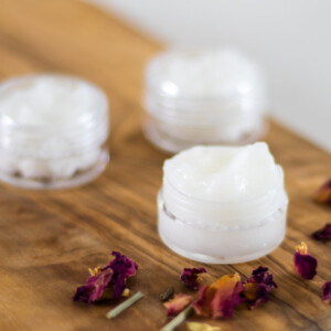 under eye cream in small white containers