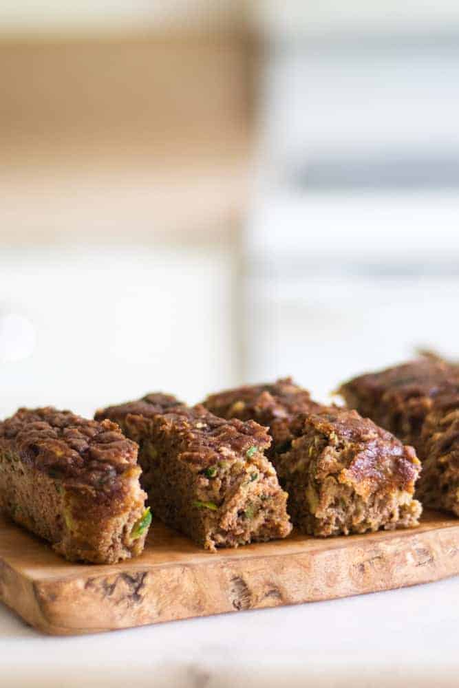 fresh sliced zucchini bread on cutting board