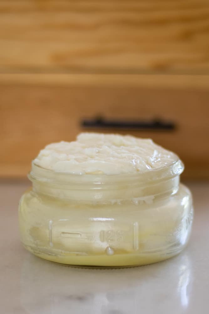 Baby moisturizer for sensitive skin in a glass airtight container.