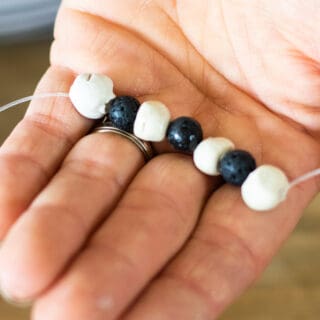 essential oil bracelet on elastic string in hand