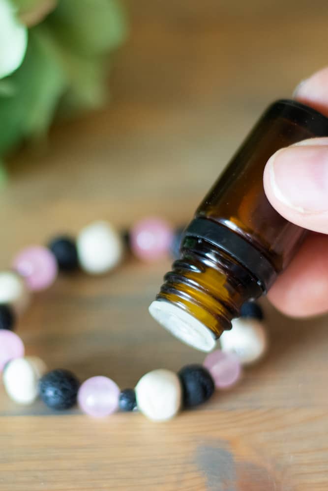 Adding essential oils to homemade diffuser bracelet