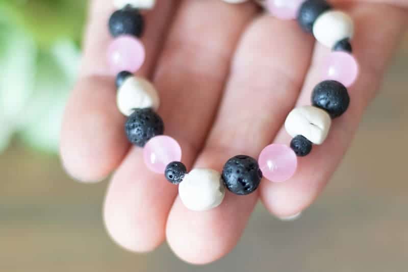 homemade essential oil bracelet in women's hand