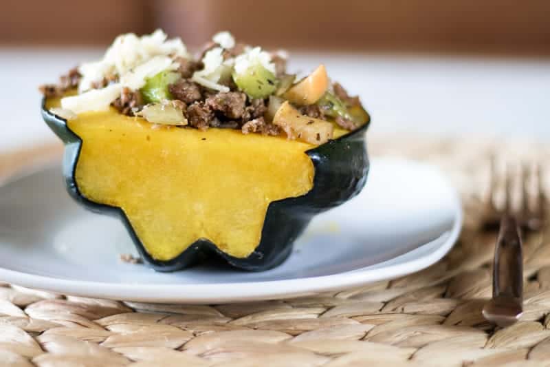 stuffed acorn squash on white plate