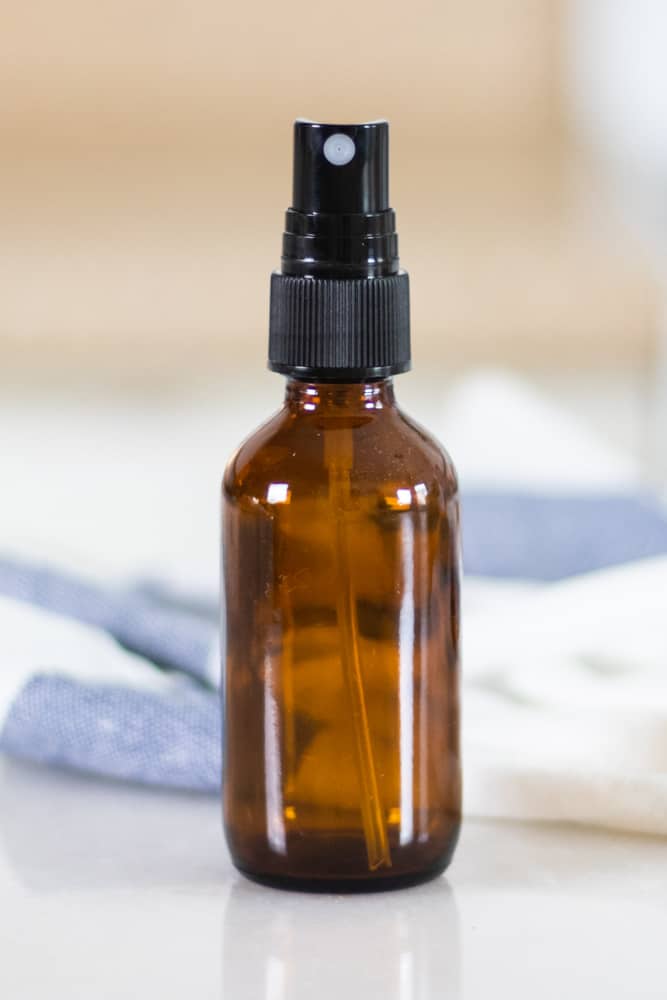 Homemade face toner in glass spray bottle.