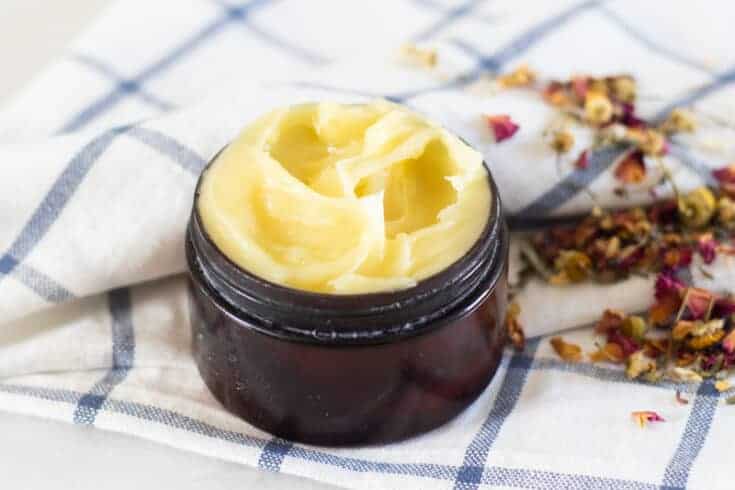 anti-aging face cream in small amber container