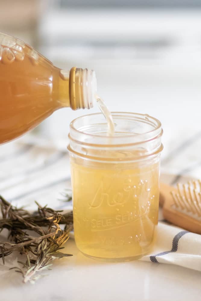 Adding the apple cider vinegar to the hair rinse.