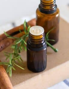 amber colored essential oil bottles on cardboard box