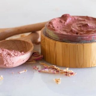 Rose clay face mask in wooden container.
