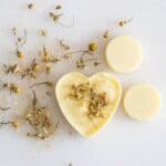 beeswax scented sachet on white marble with dried flowers