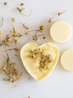 beeswax scented sachet on white marble with dried flowers