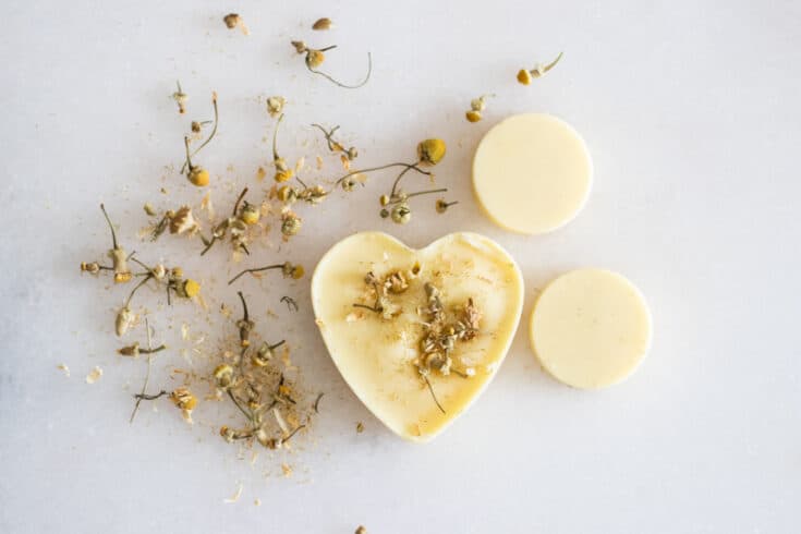 beeswax scented sachet on white marble with dried flowers