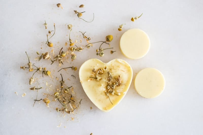 homemade air fresheners on white marble with dried flowers