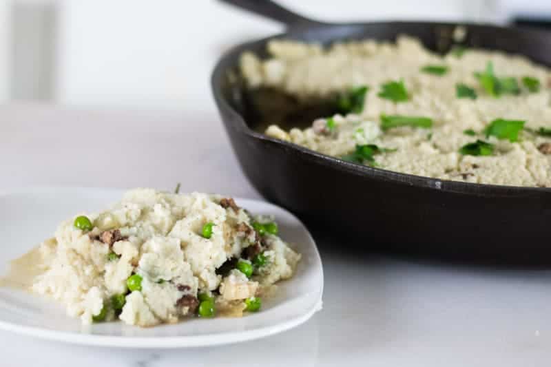 shepherd's pie with cauliflower mashed potatoes on white plate