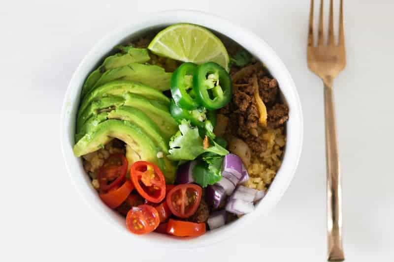 taco bowl with fresh toppings in white bowl
