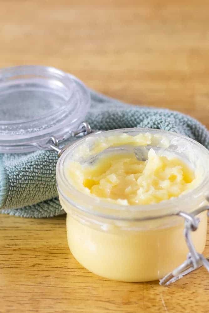 homemade beeswax furniture polish in small glass locking top mason jar