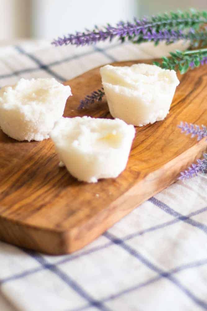 lavender bubble bath bars with sprigs of lavender behind them